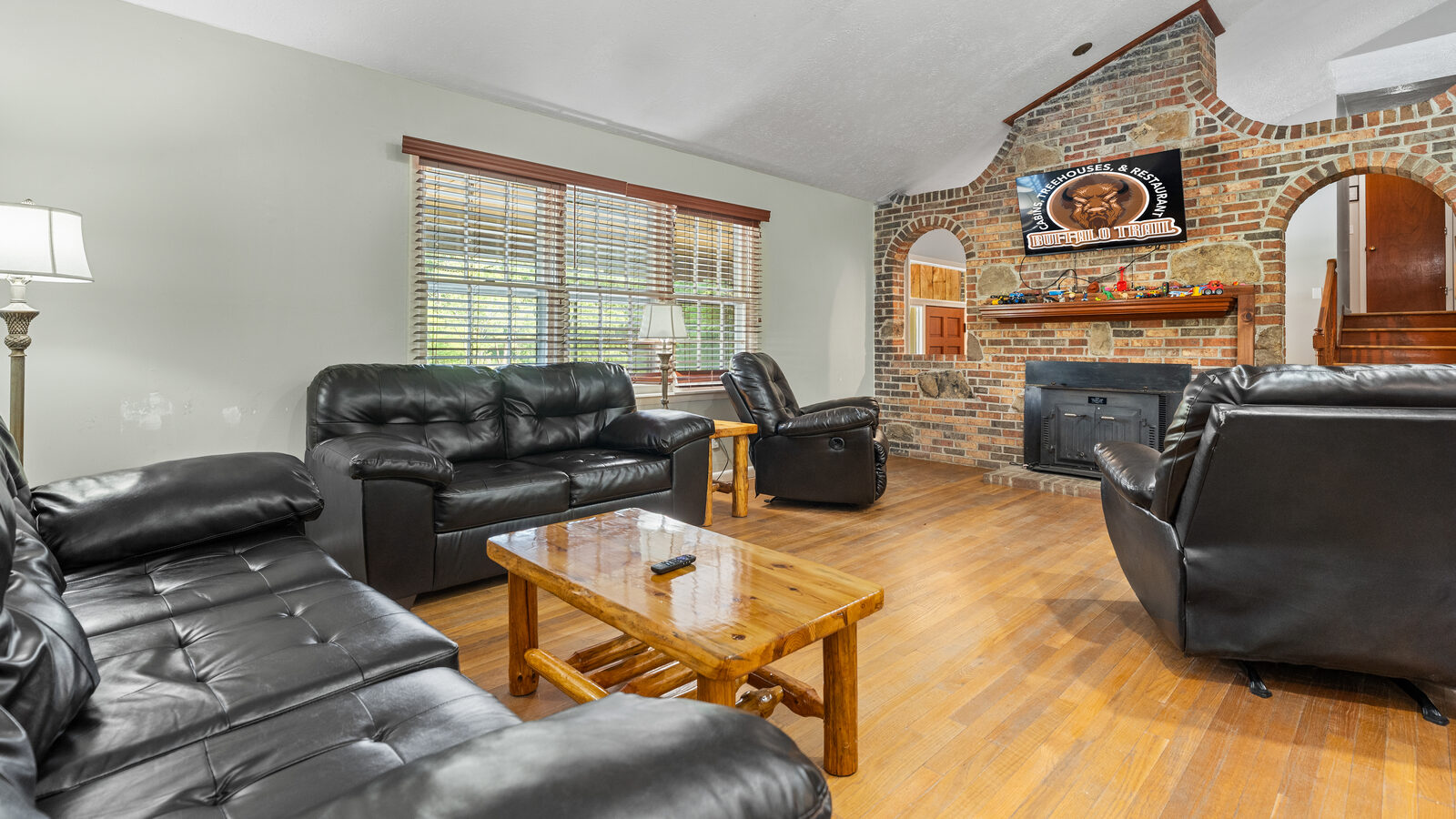 Living room with stone fireplace