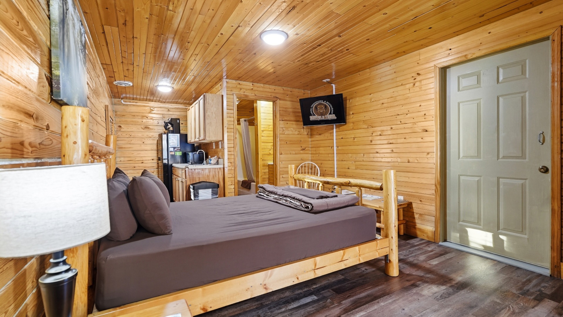 Cozy studio interior with log bed