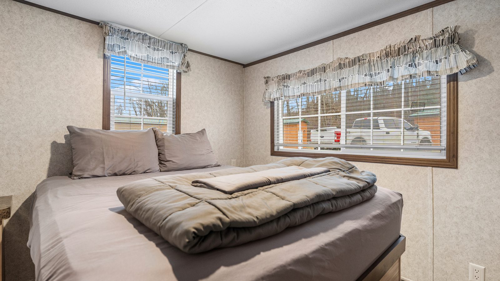 Queen bedroom with natural light