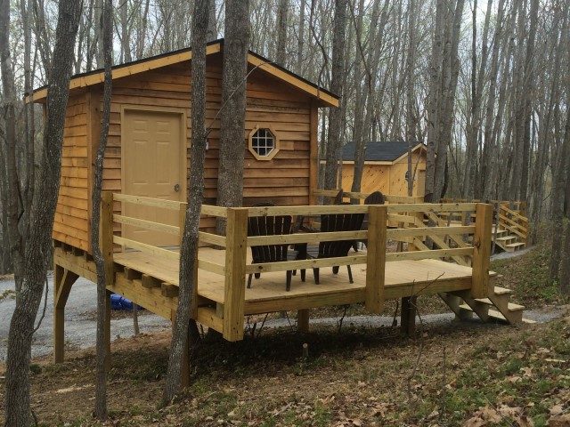 Treehouse deck with adirondack chairs